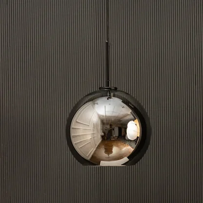 Smoked glass globe pendant light with black suspension sleek modern ceiling lamp perfect for dining and luxury living interiors.