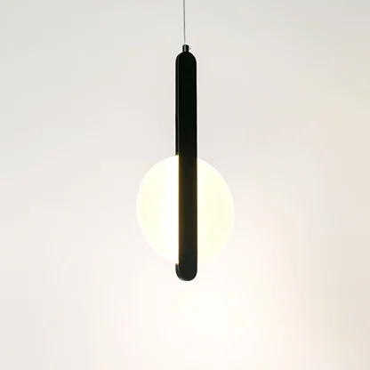 Illuminated black linear pendant light with frosted diffuser creating soft ambient lighting indoors.