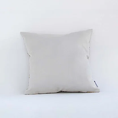 Back side view of white botanical cushion cover showing neat stitching smooth fabric finish and concealed closure.