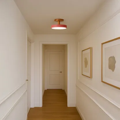 Modern ceiling light shown in a simple room setting with a natural wood mount and soft pink shade adding a warm minimal touch.