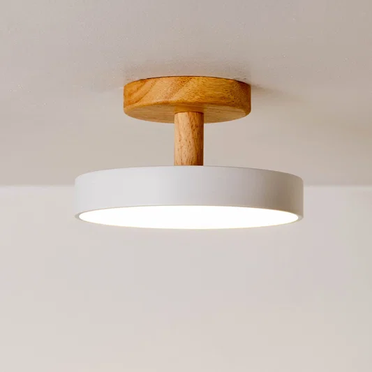Closeup of white metal and natural wood ceiling light for Scandinavian interior and modern decor styling spaces.