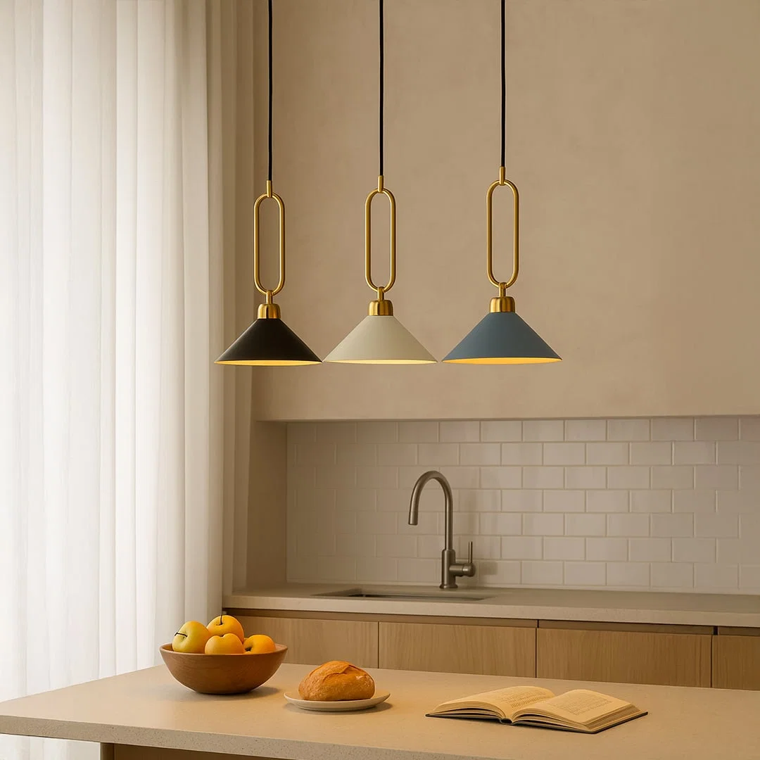 Colorful metal pendant lights with gold loop accents enhancing kitchen decor with contemporary appeal.