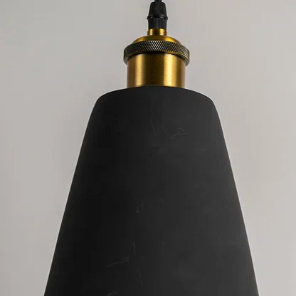 Detailed view of black metal pendant light highlighting premium finish and elegant gold hardware.