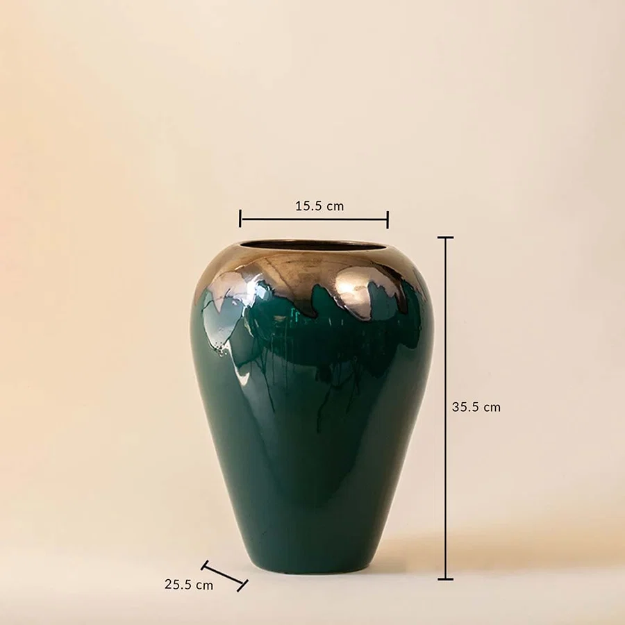 Tall green vase with gold toned upper section shown with height and width measurements on a plain background.