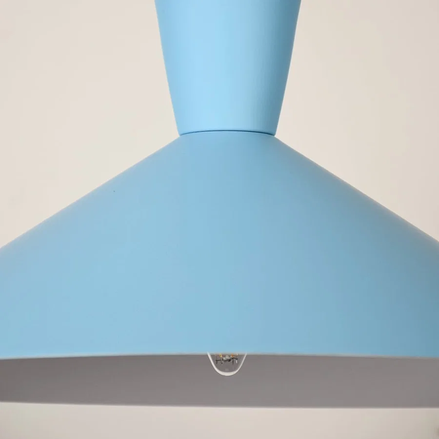 Blue metal pendant light closeup highlighting smooth finish and premium modern lighting craftsmanship details.