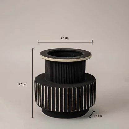 Black and white ribbed ceramic vase with matte finish showing 17 cm height and 17 cm width on white background dimension view.