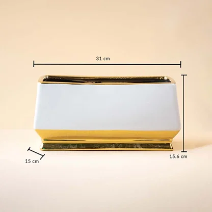 White rectangular ceramic vase with gold detailing shown with measurements of 31 cm length and 15.6 cm height against a soft beige backdrop emphasizing its sleek proportions.