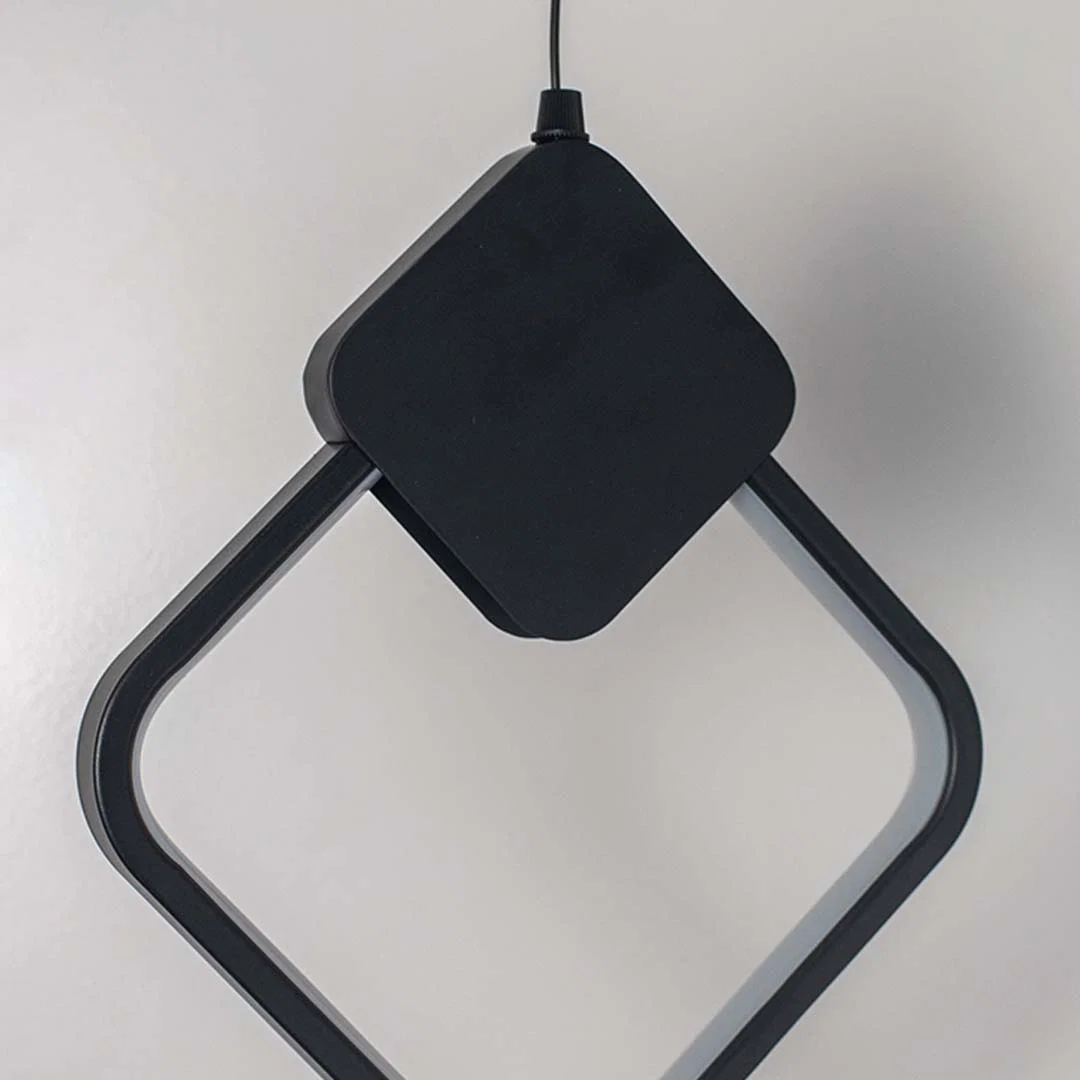 Closeup of black geometric pendant light showcasing sleek lines and premium craftsmanship details.