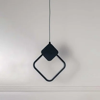 Minimalist black metal square ring pendant light designed for elegant modern living spaces.