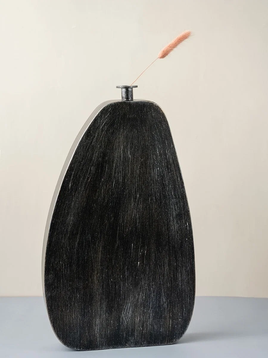 Tall black wooden vase with textured matte finish modern decorative accent for stylish home interior decor.