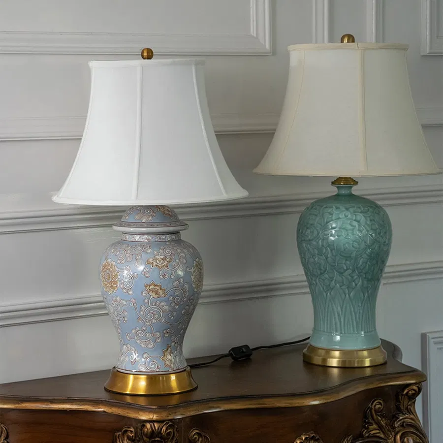 Blue and green ceramic table lamps with fabric shades offering refined traditional lighting and decorative home accents.