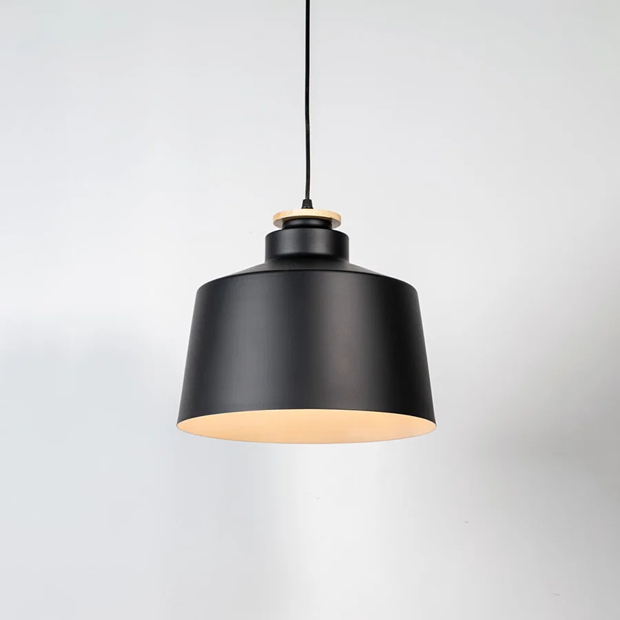 Black metal pendant light with matte finish and industrial drum design for contemporary ceiling lighting decor.