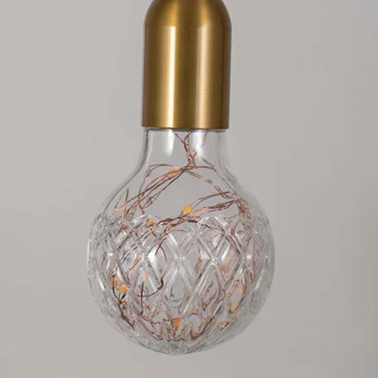 Closeup of clear glass pendant light with intricate wire design showcasing premium craftsmanship.