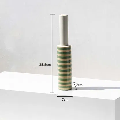 A striped decorative vase shown with dimensions marking 35.5 cm height and 7 cm width clearly displaying its slim tall structure for accurate product understanding.