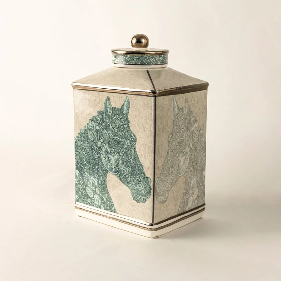 White ceramic jar with green textured horse design in a close-up view ideal for contemporary décor styling and elegant home accents.