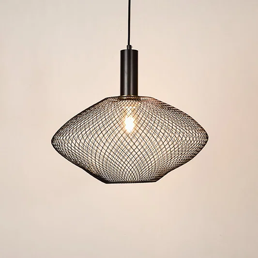 Black metal mesh pendant light illuminated to showcase industrial ceiling lighting with modern design and warm glow.
