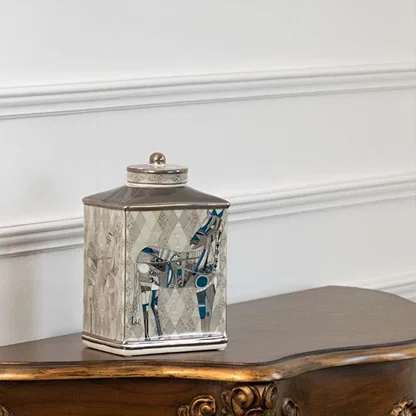 White ceramic jar with blue horse scene artwork in a front view perfect for luxury décor styling and console display placement.