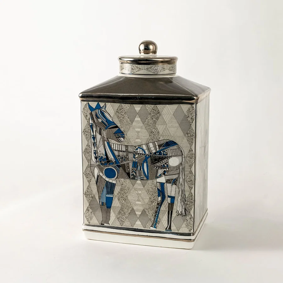 Ceramic jar with detailed blue equestrian artwork shown in a closeup view highlighting fine brush detailing premium craftsmanship and artistic décor suitable for elegant luxury home styling.