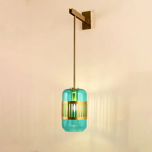 Modern turquoise glass pendant wall light with warm glow for stylish bedroom and luxury decor spaces.

