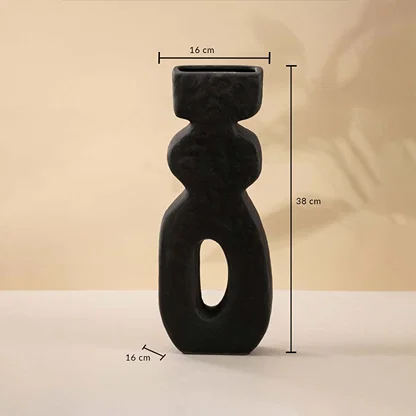 Black sculptural ceramic vase measuring 38 cm in height and 16 cm in width shown with clear size dimensions.