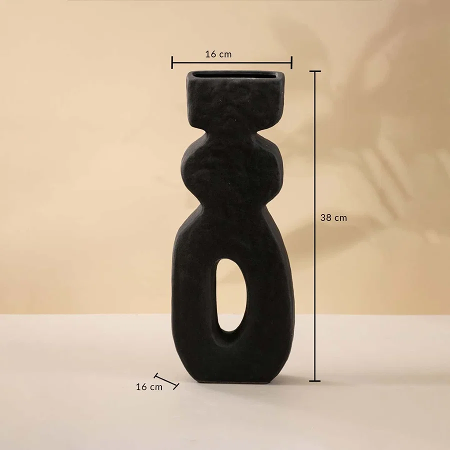 Black sculptural ceramic vase measuring 38 cm in height and 16 cm in width shown with clear size dimensions.
