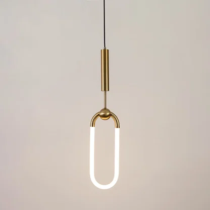 Gold metal pendant light with frosted acrylic loop illuminated to showcase minimalist contemporary ceiling lighting.