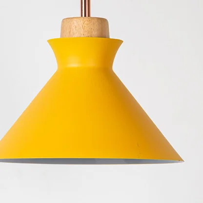Yellow metal pendant light with natural wood detailing showcasing sleek cone shape and modern Scandinavian style.