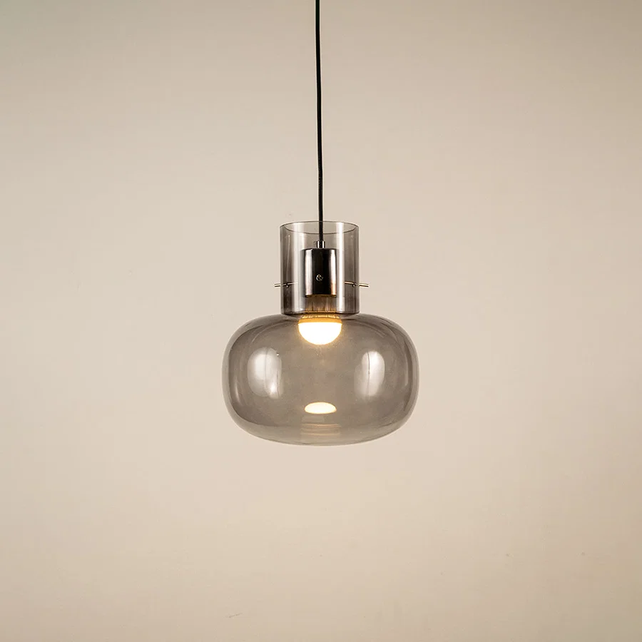 Smoke glass pendant light with black metal fixture showcasing modern ceiling lighting and elegant contemporary design.