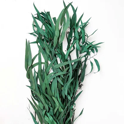Close view of faux eucalyptus stem reveals realistic leaf veins natural curves and handcrafted details that mimic real greenery beautifully.