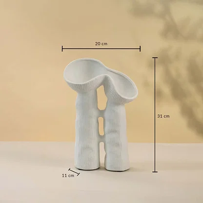 White sculptural ceramic vase measuring 31 cm in height and 20 cm in width displayed with measurements.