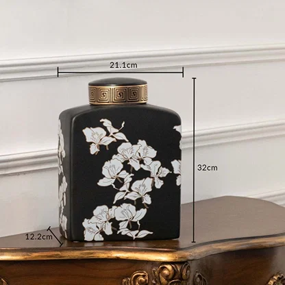 Black ceramic jar with white floral artwork measuring 16.5 cm width and 26 cm height ideal for elegant console décor and modern home styling.