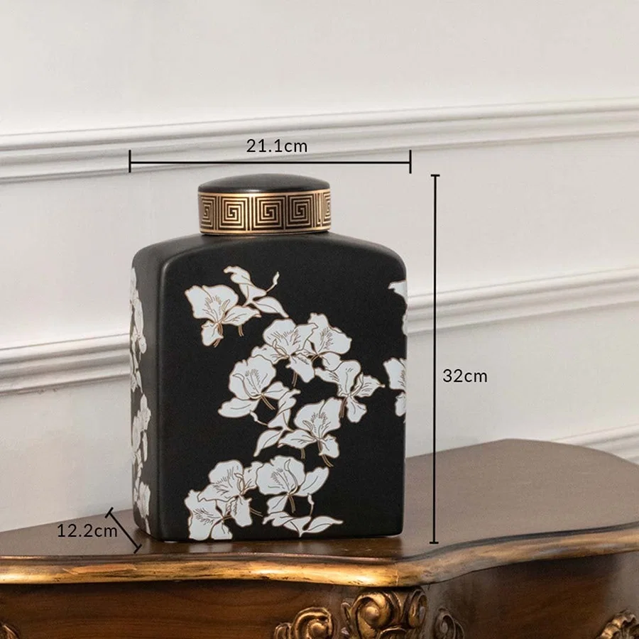 Black ceramic jar with white floral artwork measuring 16.5 cm width and 26 cm height ideal for elegant console décor and modern home styling.
