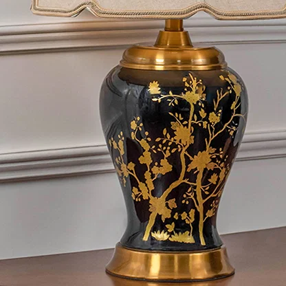 Black gold floral lamp on wooden console table with light on and white panelled wall background for classic luxury d‚àö¬¢¬¨√†¬¨√∂‚àö√á¬¨¬©cor.
