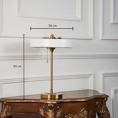 Modern white-shade table lamp with gold stand shown with 49 cm height 36 cm shade width and 18 cm base width for size reference.