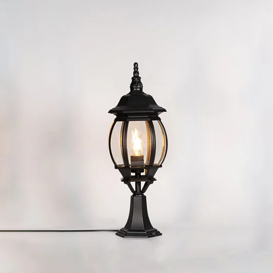 Classic black outdoor gate light with warm glowing bulb for stylish exterior decor styling use.