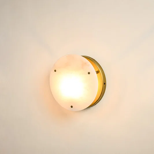 Modern marble wall light with warm ambient glow for elegant hallway and luxury decor styling spaces.