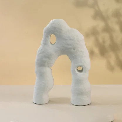 White ceramic abstract decorative sculpture set with artistic organic silhouettes for contemporary home decor styling.