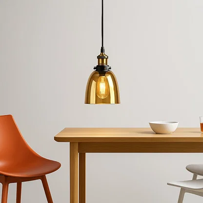 Amber smoked glass pendant light above dining table adding warm ambient lighting and modern elegance to interiors.