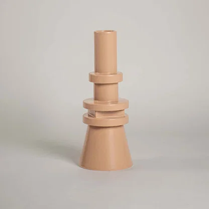 Peach ceramic decorative vase with stacked geometric design for tabletop styling and modern home decor displays.