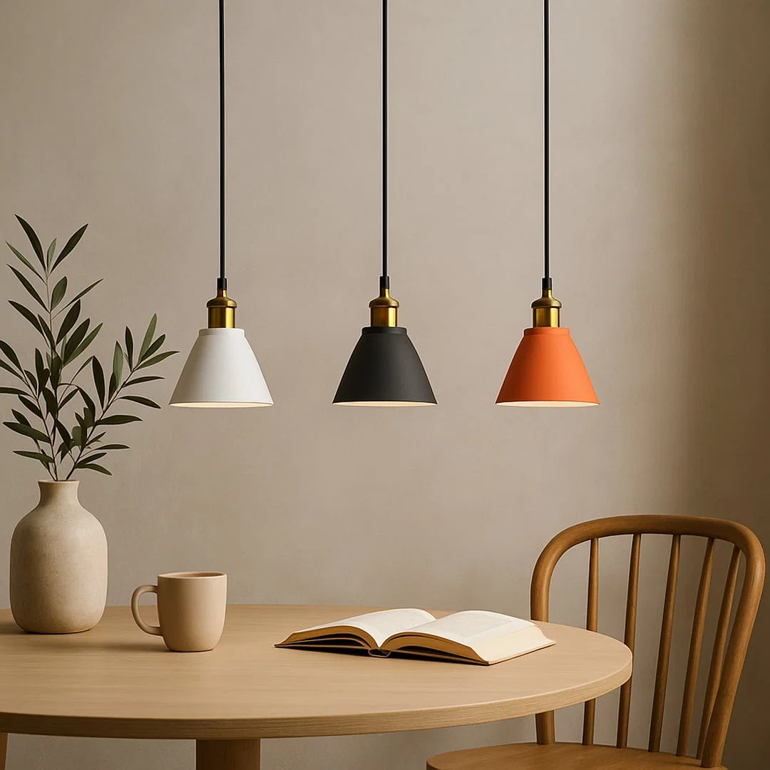 White and terracotta metal pendant lights above dining table adding modern warmth and stylish appeal.
