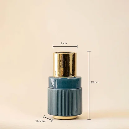 Blue ribbed ceramic vase with gold neck featuring 29 cm height 16.5 cm base width and 9 cm top diameter.