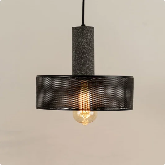 Black ribbed glass pendant light with textured shade creating warm ambient illumination for modern interiors.