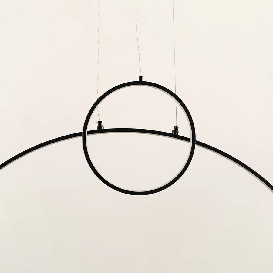 A modern black ring ceiling light featuring a clean curved bar ideal for minimal LED lighting and contemporary designer ceiling décor in stylish interiors.