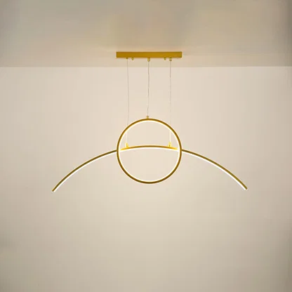 Gold metal circular LED pendant light with integrated illumination creating elegant modern ambient ceiling lighting.