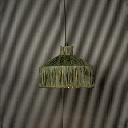 Green woven pendant light with a geometric shape glowing softly and adding a natural textured highlight that brings a handcrafted touch to the space.