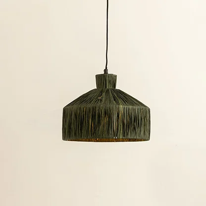 Green woven fiber pendant light illuminated to showcase organic decorative ceiling lighting with artisanal appeal.
