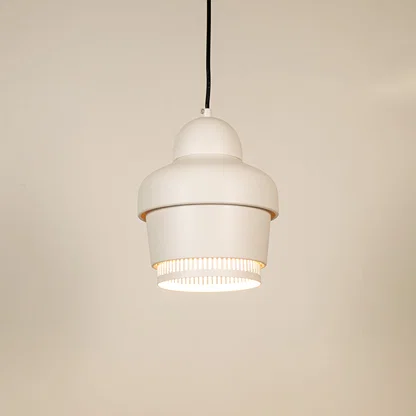 White metal pendant light illuminated to showcase contemporary ceiling lighting with clean minimalist design appeal.