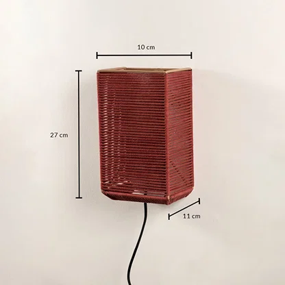 Rectangular rust red woven wall light fixture displaying a height of twenty-seven centimeters on a plain background.