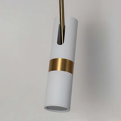 Closeup of white cylindrical pendant light with polished gold details showcasing premium craftsmanship.