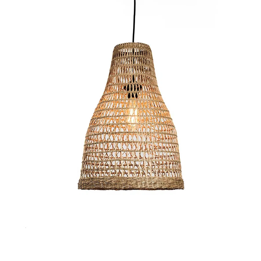 Handwoven rattan pendant light with tapered bell shape and open weave texture hanging against soft neutral wall background for warm boho decor.